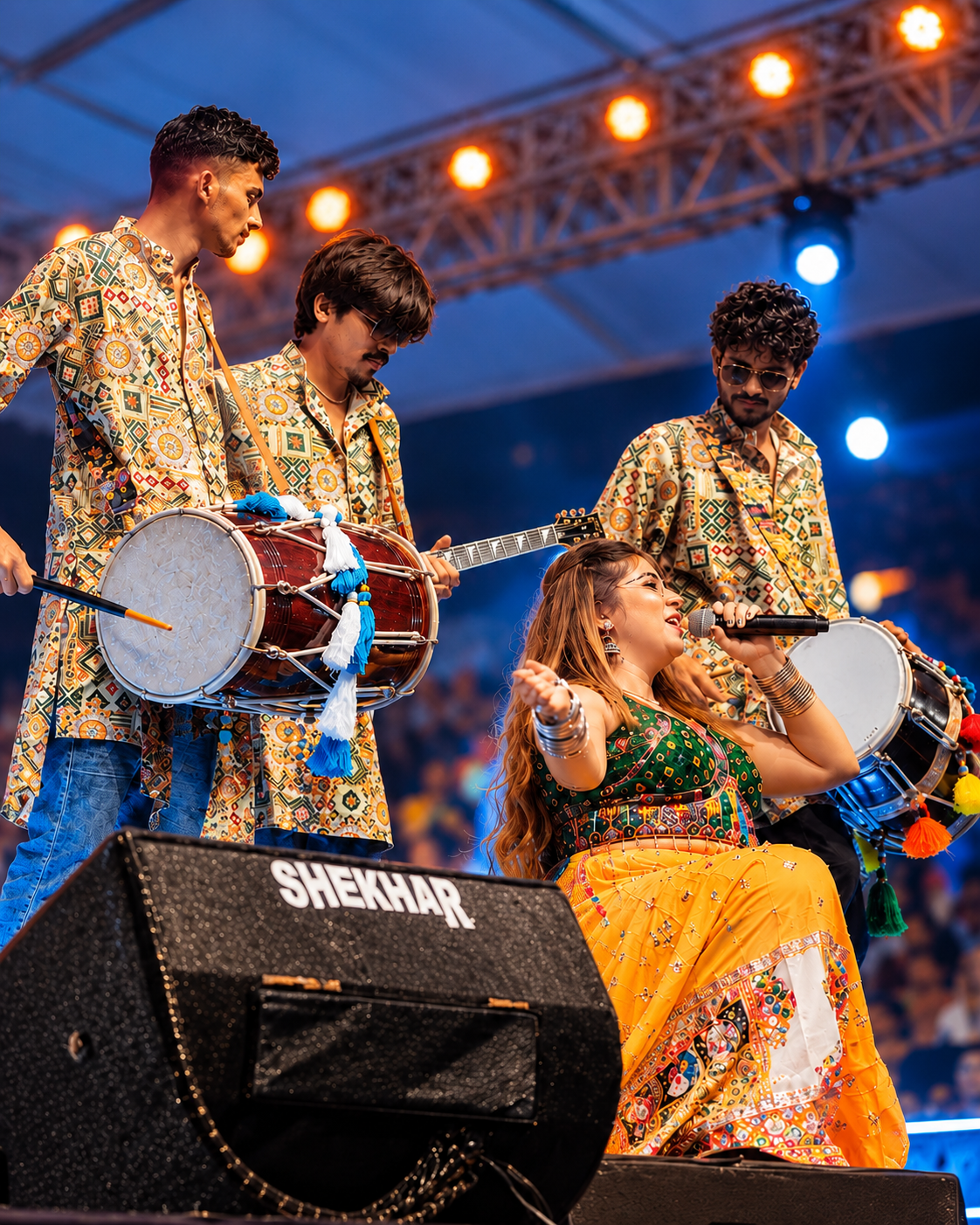 Kanchhan singing alongside live percussionists